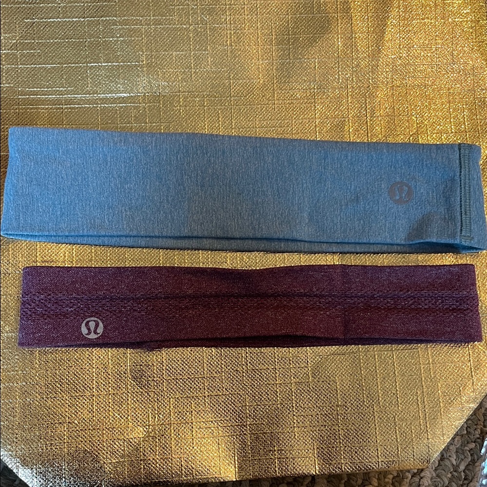 Lululemon Headbands 1 swiftly in heathered plum color and 1 in limitless Blue